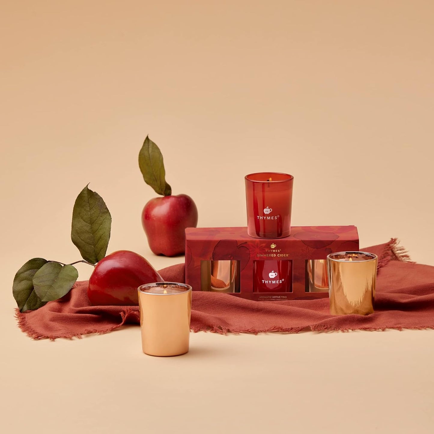 Thymes Aromatic Votive Trio – Set of Three Votive Candles – Luxury Home Fragrance – Scented Candles with Notes of Freshly Pressed Apple, Clove, & Cardamom – Red & Rose Gold (Simmered Cider, 2 Oz Each)